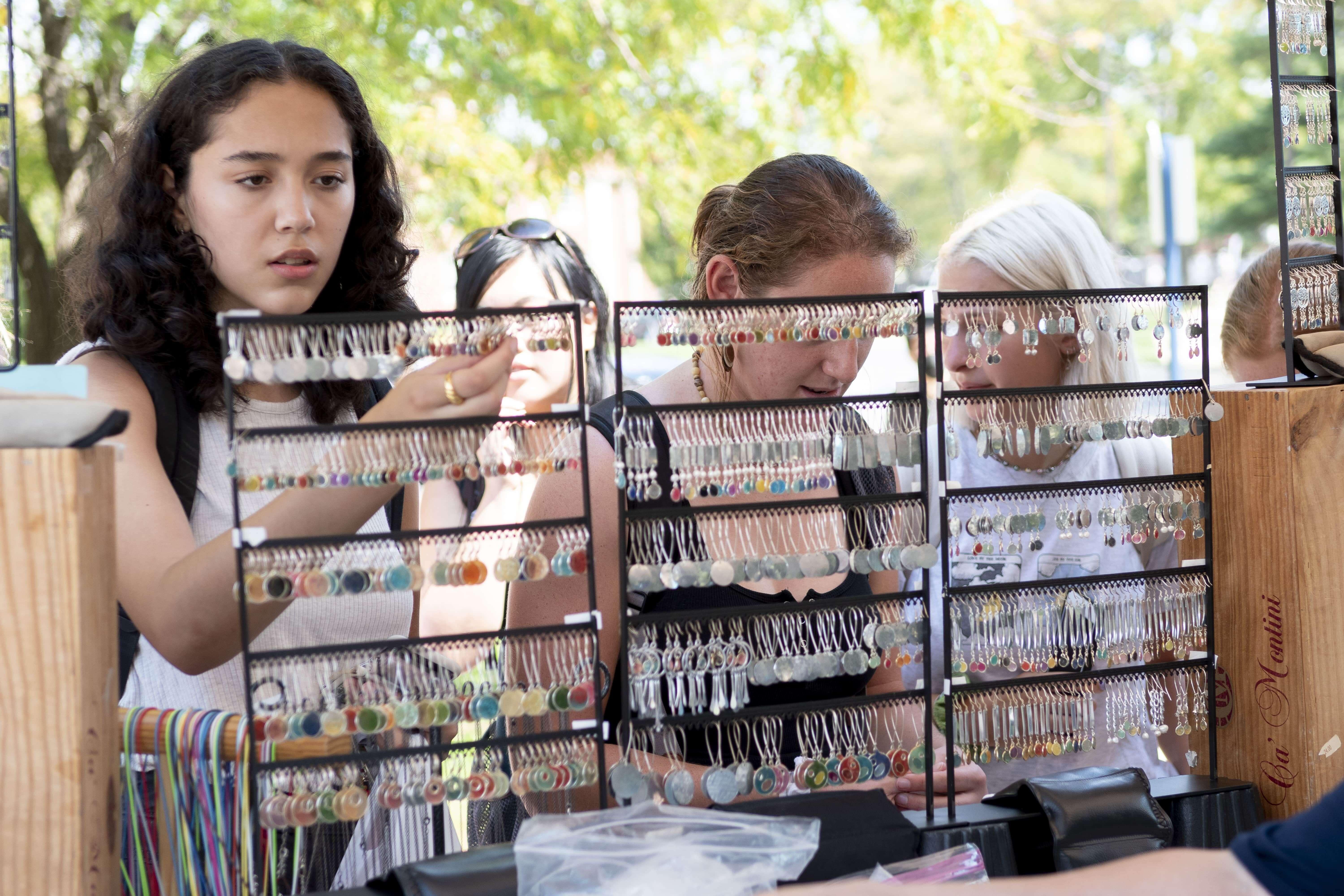 People selecting Farmers Market Jewelry 