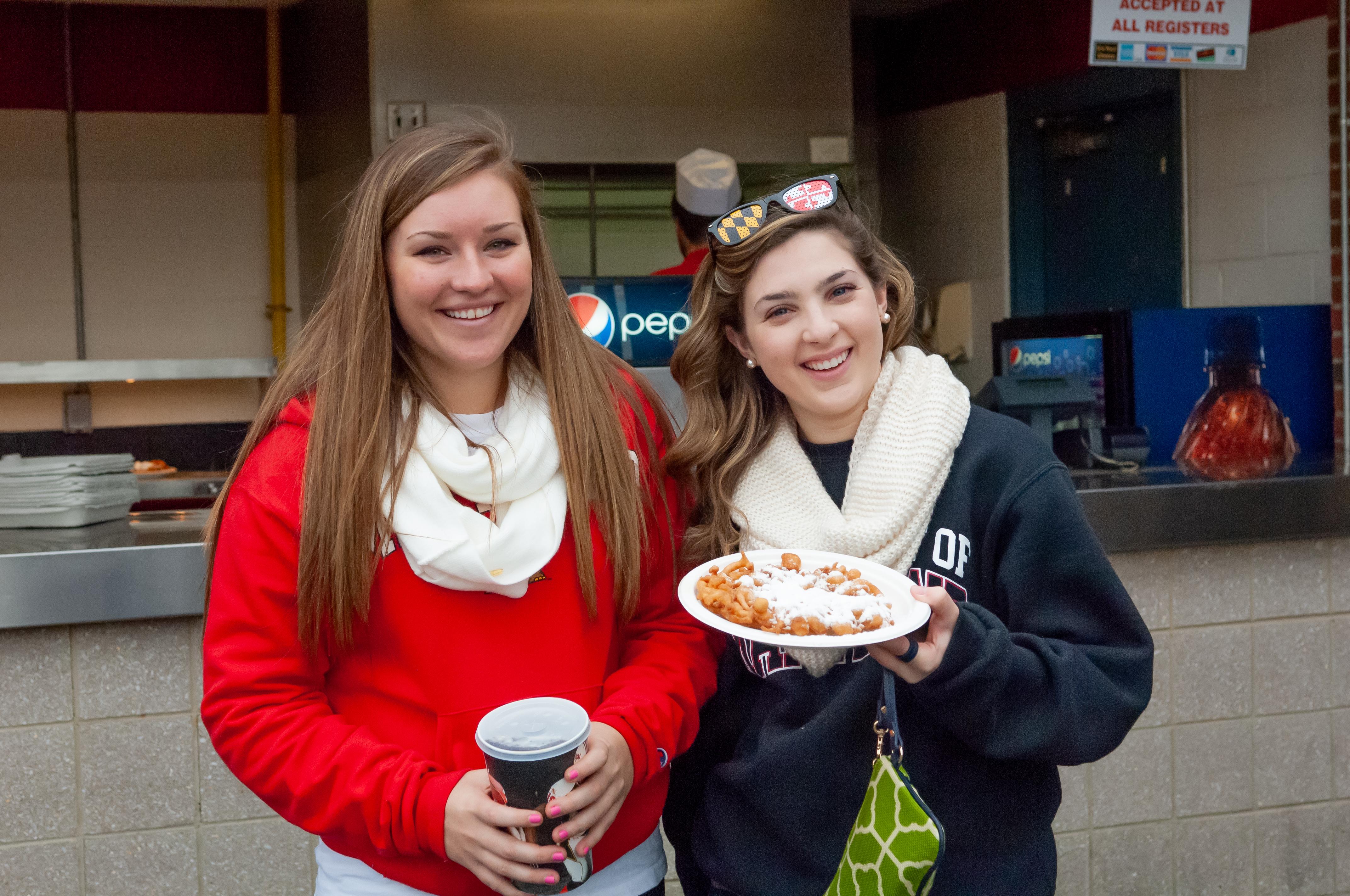 2 women with food from Concessions